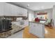 Bright, updated kitchen with white cabinets, granite countertops, and modern appliances at 9411 Harroway Rd, Summerville, SC 29485