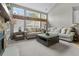 Bright living room with comfortable seating, a cathedral ceiling, and large windows providing an abundance of natural light at 9411 Harroway Rd, Summerville, SC 29485