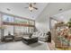 Spacious living room with cathedral ceiling, ample natural light from large windows, and comfortable seating at 9411 Harroway Rd, Summerville, SC 29485
