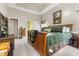 Spacious main bedroom features a wood bed frame and neutral-colored walls at 9411 Harroway Rd, Summerville, SC 29485