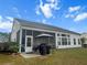 The home has a screened porch and a patio with an outdoor gazebo at 9411 Harroway Rd, Summerville, SC 29485