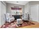 Cozy sitting area with patterned armchairs, accent rug, and soft natural lighting at 9411 Harroway Rd, Summerville, SC 29485