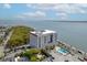Attractive aerial view of a building with a parking and pool area with the ocean as its backdrop at 1 King St # 209/210, Charleston, SC 29401