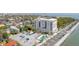 Wonderful aerial view showcasing a building with a beautiful swimming pool, parking, and water view at 1 King St # 209/210, Charleston, SC 29401