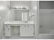 Bathroom featuring a wide mirror, vanity, and shower/tub combination at 1 King St # 209/210, Charleston, SC 29401