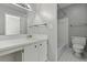 Bathroom featuring a wide mirror, vanity, toilet, and shower/tub combination at 1 King St # 209/210, Charleston, SC 29401
