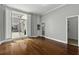 Lovely bedroom with beautiful hardwood floors, shutters, built-in cabinetry, and plenty of natural light at 1 King St # 209/210, Charleston, SC 29401