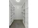 Bright, walk-in closet with custom shelving and ample storage space at 1 King St # 209/210, Charleston, SC 29401