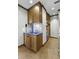Kitchen showcasing wood cabinets, blue countertops, mosaic backsplash, and stainless steel appliances at 1 King St # 209/210, Charleston, SC 29401