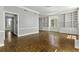 Spacious living room with hardwood floors, fireplace, and built-in bookcases at 1 King St # 209/210, Charleston, SC 29401