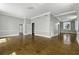 Spacious living room with hardwood floors, crown molding, and open doorways at 1 King St # 209/210, Charleston, SC 29401