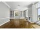 Living room showcasing hardwood floors, built-in shelving, fireplace and bright windows at 1 King St # 209/210, Charleston, SC 29401