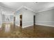 Open living room design with hardwood floors and natural light from window at 1 King St # 209/210, Charleston, SC 29401