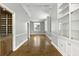 Large open living room featuring a built-in bar, and a wall of built-in shelving at 1 King St # 209/210, Charleston, SC 29401