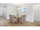 Elegant dining room featuring a modern chandelier and stylish table setting, perfect for formal dinners or casual gatherings at 1019 Swamp Rose Run, Summerville, SC 29485