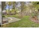 A spacious backyard featuring a well-maintained lawn and partial concrete patio at 102 Brutus Ln, Summerville, SC 29485