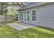 View of the backyard with concrete patio, lawn and privacy fence at 102 Brutus Ln, Summerville, SC 29485