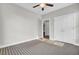 Bedroom featuring windows with decorative shelving, a ceiling fan, and carpet at 102 Brutus Ln, Summerville, SC 29485
