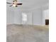 Bedroom features carpet, ceiling fan, large windows and doorway to the bathroom at 102 Brutus Ln, Summerville, SC 29485