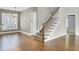 Inviting entryway featuring wood floors and a staircase with decorative carpet at 102 Brutus Ln, Summerville, SC 29485