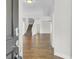 Open foyer with hardwood floors, staircase, and ample natural light filtering through the doorway at 102 Brutus Ln, Summerville, SC 29485