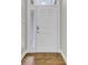 Modern front door with digital lock and glass sidelight, set against wood floors at 102 Brutus Ln, Summerville, SC 29485