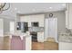 Kitchen features granite countertops, stainless appliances, white cabinets and access to other rooms at 102 Brutus Ln, Summerville, SC 29485