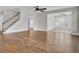 Open concept living room features hardwood floors, a ceiling fan and staircase to the second level at 102 Brutus Ln, Summerville, SC 29485