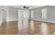 Bright living room with hardwood floors and ample windows showcasing a serene outdoor view at 102 Brutus Ln, Summerville, SC 29485