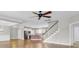 Open floor plan with hardwood floors featuring a staircase to the second level and entry to the kitchen at 102 Brutus Ln, Summerville, SC 29485