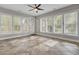 Bright sunroom with tile floors and multiple windows offering natural light and views of the backyard at 102 Brutus Ln, Summerville, SC 29485