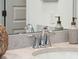 Bathroom detail showcasing a sleek faucet, stylish soap dispensers, and elegant countertop at 1020 Sagegrass St, Summerville, SC 29485