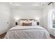 Cozy bedroom featuring a plush bed, stylish lighting, and a serene view from the window at 1020 Sagegrass St, Summerville, SC 29485