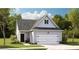 Charming one-story home with a gray exterior, attached garage, and well-manicured front yard at 1020 Sagegrass St, Summerville, SC 29485