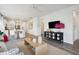 Bright and airy living room with modern decor and hardwood floors that transition to a dining and kitchen area at 1025 Swamp Rose Run, Summerville, SC 29485