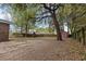 Large backyard featuring a storage shed and mature trees, with ample space for outdoor activities at 103 Beverly Dr, Ladson, SC 29456