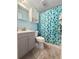 Bathroom with blue walls, a shower with a patterned curtain, and a gray vanity at 103 Beverly Dr, Ladson, SC 29456