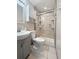 Modern bathroom with a gray vanity, a toilet, and a glass enclosed shower at 103 Beverly Dr, Ladson, SC 29456