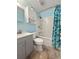 Bathroom with blue walls, a bathtub and shower, and a gray vanity at 103 Beverly Dr, Ladson, SC 29456