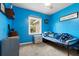 Blue bedroom with a single bed, a window, and carpeted floors at 103 Beverly Dr, Ladson, SC 29456