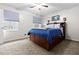 Cozy bedroom features a full size bed with storage, a ceiling fan and natural lighting at 103 Beverly Dr, Ladson, SC 29456