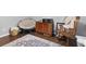 Relaxing bedroom features a papasan chair, rocking chair, console and patterned rug at 103 Beverly Dr, Ladson, SC 29456