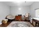 Relaxing bedroom features a comfy papasan chair, rocking chair, and decorative rug at 103 Beverly Dr, Ladson, SC 29456