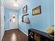 Bright entryway with blue walls, wood floors, and functional storage at 103 Beverly Dr, Ladson, SC 29456
