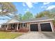 Charming brick ranch with attached two car garage and covered front porch at 103 Beverly Dr, Ladson, SC 29456