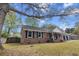 Red brick home with black shutters and attached garage and welcoming front porch at 103 Beverly Dr, Ladson, SC 29456