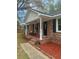 Inviting front porch with seating, red mulch landscaping and address number at 103 Beverly Dr, Ladson, SC 29456