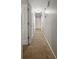 Carpeted hallway with neutral walls and multiple doors offers access to different rooms at 103 Beverly Dr, Ladson, SC 29456
