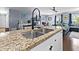 Granite countertops and a black modern faucet make this kitchen stand out at 103 Beverly Dr, Ladson, SC 29456