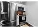 Bright kitchen features stainless steel appliances, white cabinets, and a stylish tile backsplash at 103 Beverly Dr, Ladson, SC 29456
